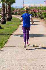 Image showing young female runner training for marathon