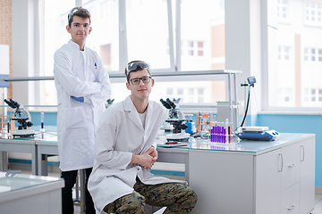 Image showing Group of young medical students doing research