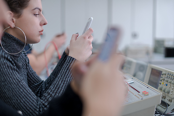 Image showing female student using a mobile phone