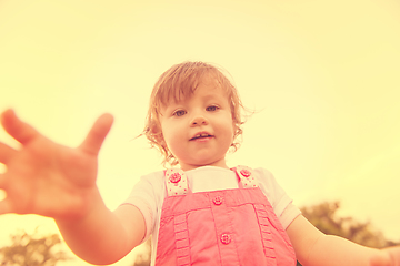 Image showing little girl spending time at backyard