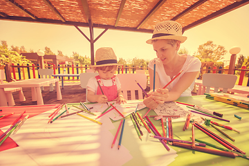 Image showing mom and little daughter drawing a colorful pictures