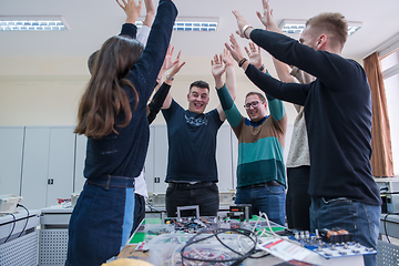 Image showing students celebrating successfully finished project