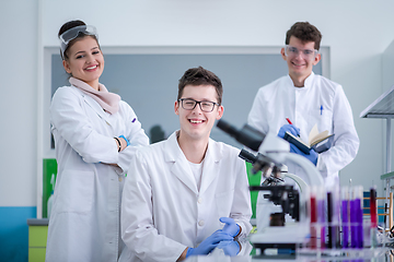 Image showing Group of young medical students doing research