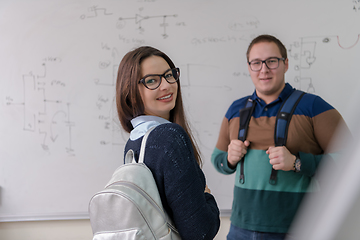 Image showing portrait of young students in front of chalkboard