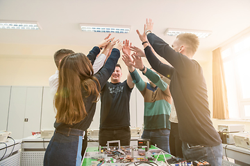 Image showing students celebrating successfully finished project