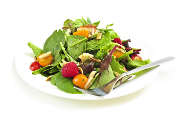 Image showing Plate of green salad on white background