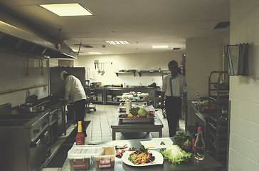 Image showing team cooks and chefs preparing meals