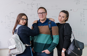 Image showing portrait of young students in front of chalkboard