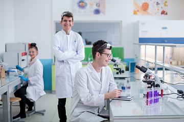 Image showing Group of young medical students doing research