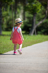 Image showing little girl runing in the summer Park