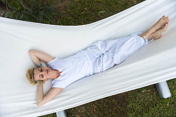 Image showing young woman resting on hammock