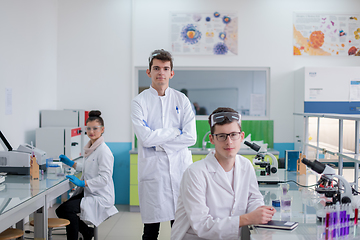 Image showing Group of young medical students doing research