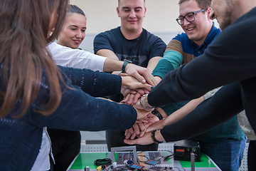 Image showing students celebrating successfully finished project