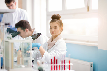 Image showing Group of young medical students doing research