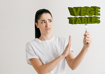 Image showing Food concept. Model holding a plate with letters of Vegetable