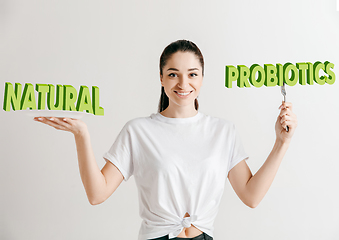 Image showing Food concept. Model holding a plate with letters of Natural Probiotics