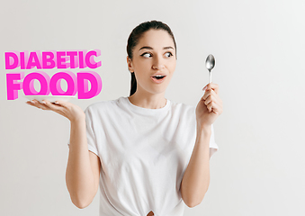 Image showing Food concept. Model holding a plate with letters of Diabetic Food