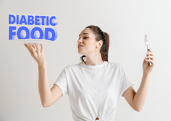 Image showing Food concept. Model holding a plate with letters of Diabetic Food