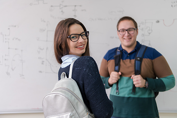 Image showing portrait of young students in front of chalkboard