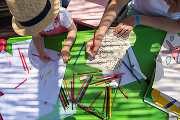 Image showing mom and little daughter drawing a colorful pictures