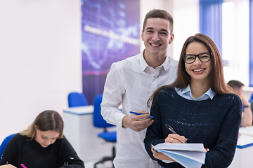 Image showing young students writing notes