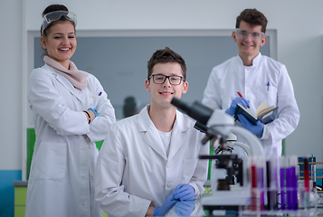 Image showing Group of young medical students doing research