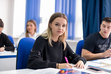 Image showing female student writing notes