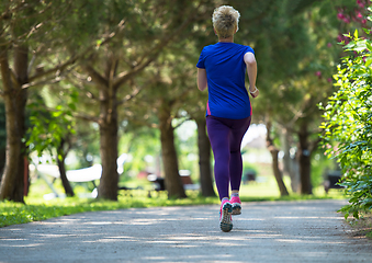 Image showing young female runner training for marathon