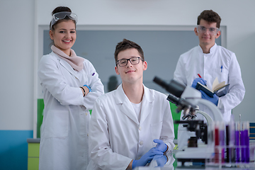 Image showing Group of young medical students doing research