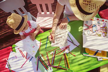 Image showing mom and little daughter drawing a colorful pictures