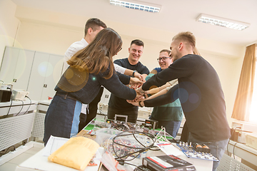 Image showing students celebrating successfully finished project