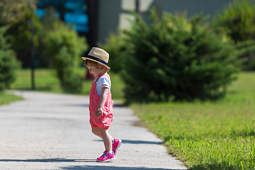 Image showing little girl runing in the summer Park