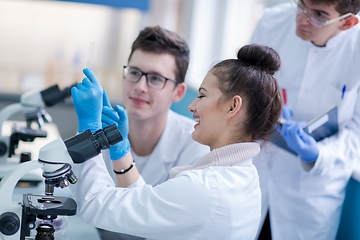 Image showing Group of young medical students doing research