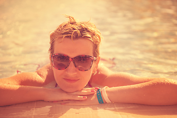 Image showing woman enjoying holidays in the swimming pool