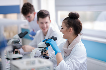 Image showing Group of young medical students doing research