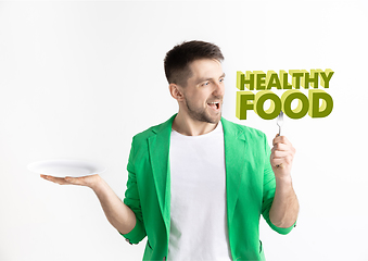 Image showing Food concept. Model holding a plate with letters of Healthy Food