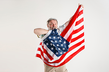 Image showing Senior man with the flag of United States of America