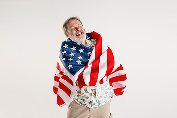 Image showing Senior man with the flag of United States of America