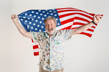 Image showing Senior man with the flag of United States of America