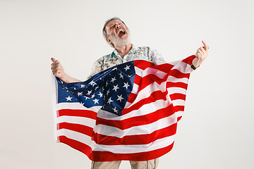 Image showing Senior man with the flag of United States of America