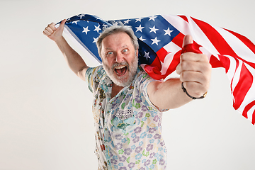 Image showing Senior man with the flag of United States of America