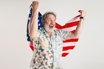 Image showing Senior man with the flag of United States of America