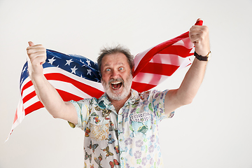 Image showing Senior man with the flag of United States of America