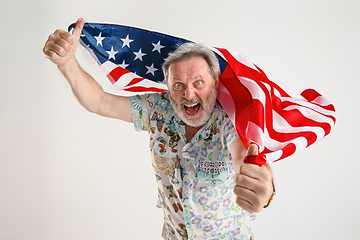 Image showing Senior man with the flag of United States of America