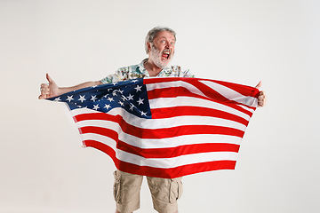 Image showing Senior man with the flag of United States of America