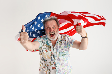 Image showing Senior man with the flag of United States of America