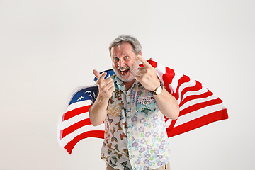 Image showing Senior man with the flag of United States of America