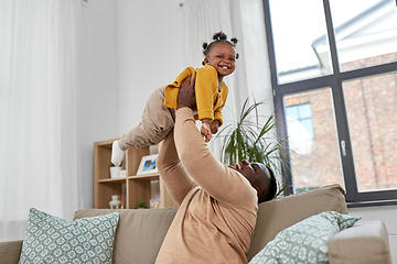 Image showing happy african american father with baby at home