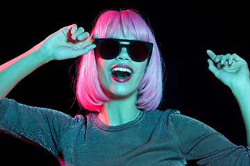 Image showing happy woman in pink wig and black sunglasses