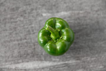 Image showing close up of green pepper on slate stone background